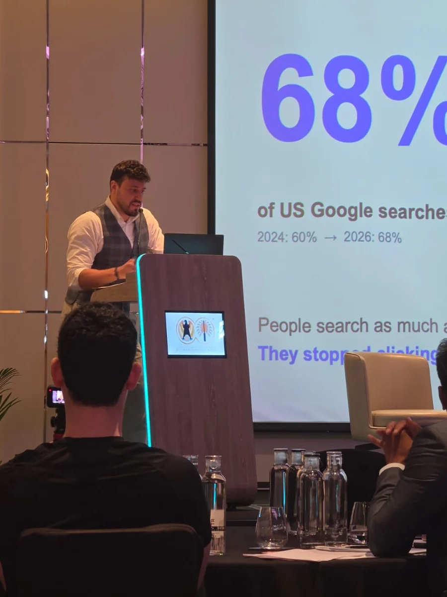 Rado speaking on stage at the AI Forum in Dubai